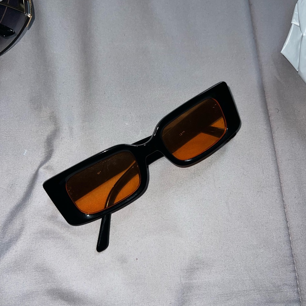 Stylish Black Sunglasses with Orange Lenses